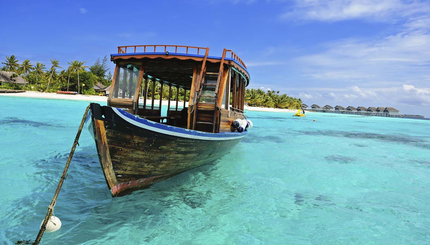 Maldives - Wooden Dhoni Boat on the shore of the Maldives